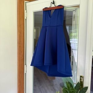 Royal blue, peplum high-low mini dress with a plunging sweetheart neckline.